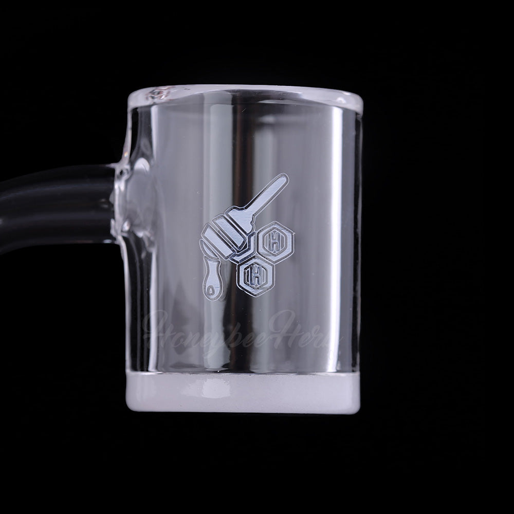 Close-up of Honey & Milk bevel quartz banger beveled edge and white base