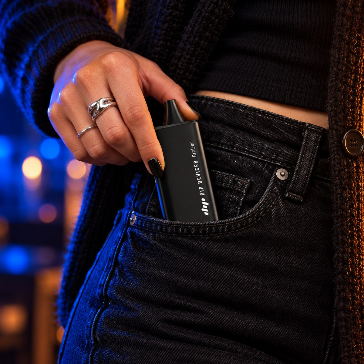 Ember electric pipe sliding into a jeans front pocket, showing its 111 mm pocket size